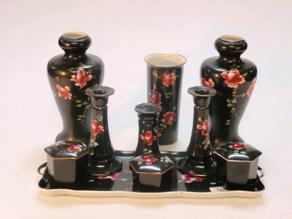 Appraisal: A Falcon ware dressing table set black ground with rose