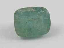 Appraisal: A loose polished cabochon emerald ct