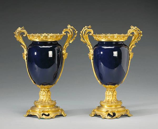 Appraisal: A pair of S vres style cobalt glazed porcelain gilt