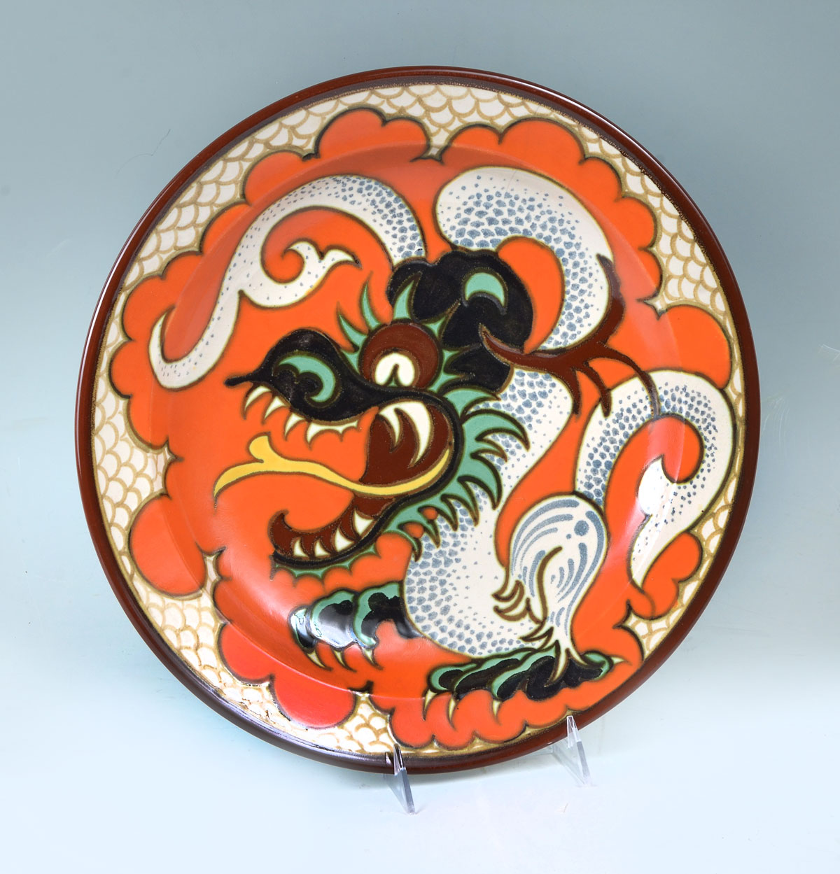 Appraisal: DRAGON GOUDA CHARGER Large 's Gouda Pudora dragon charger having