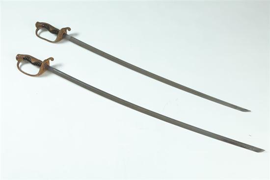 Appraisal: THREE SWORDS Japan th century Two officer's swords and a