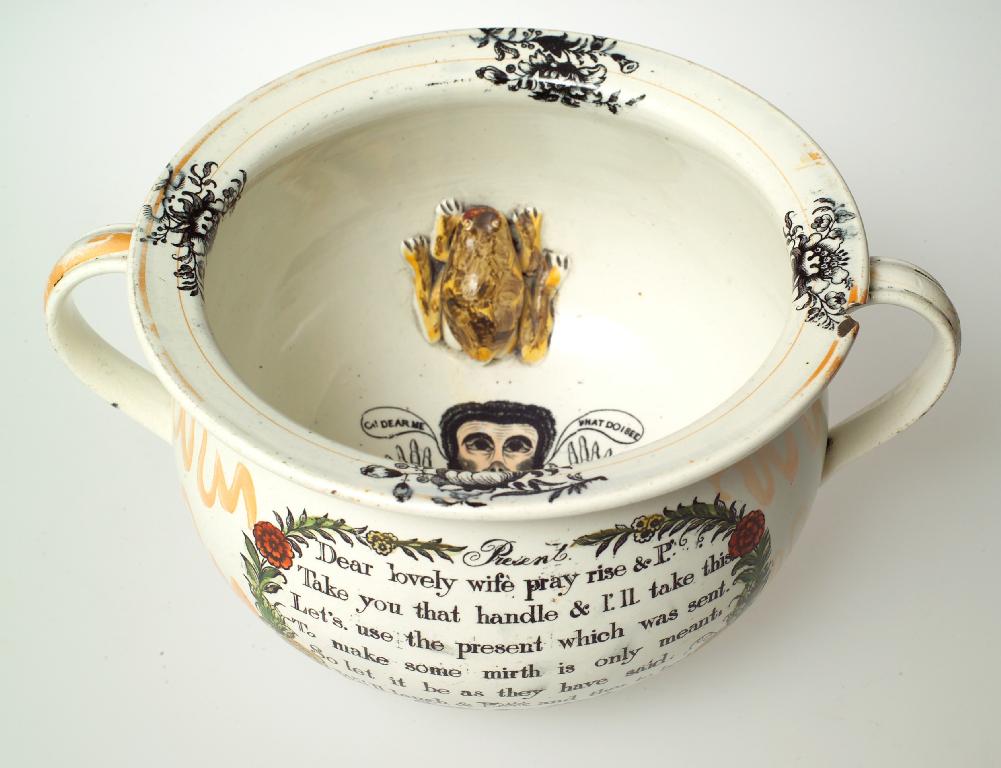 Appraisal: SUNDERLAND LUSTRE TWIN-HANDLED CHAMBER POT th century printed on both