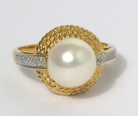 Appraisal: PEARL DIAMOND AND FOURTEEN KARAT GOLD RING centering a mm