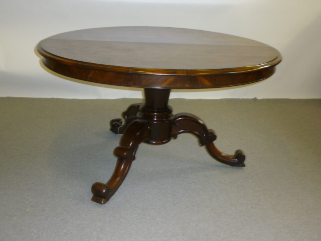 Appraisal: A VICTORIAN ROSEWOOD BREAKFAST TABLE the figured veneer tilt top