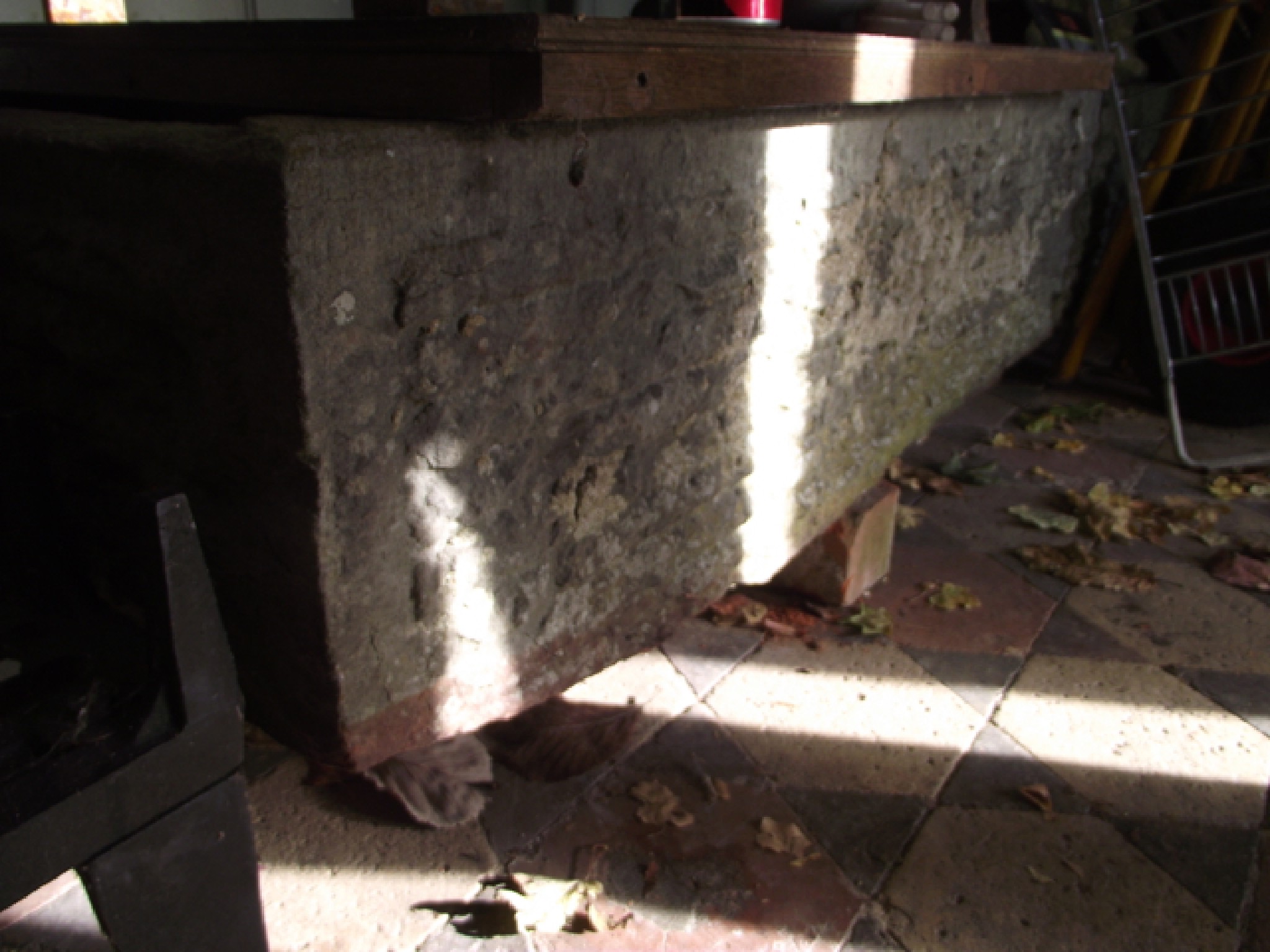 Appraisal: A weathered natural stone trough of rectangular form broken cm