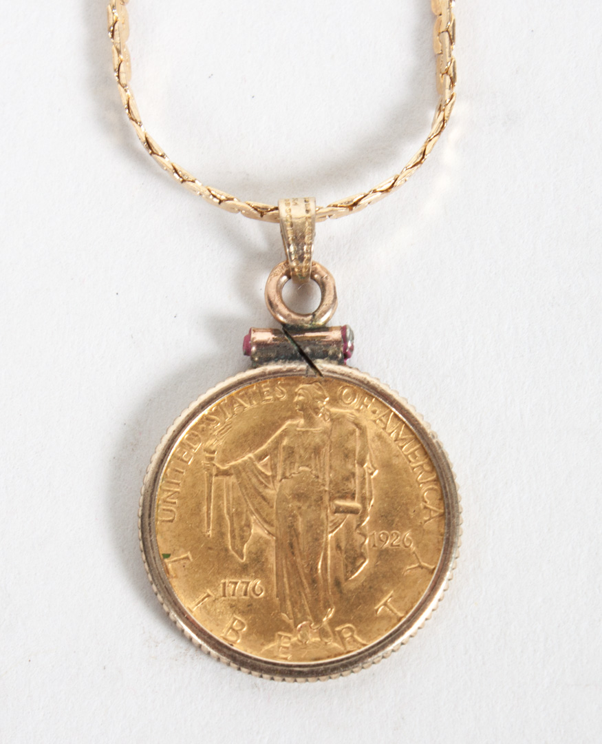 Appraisal: Commemorative gold coin pendant on a K gold chain in