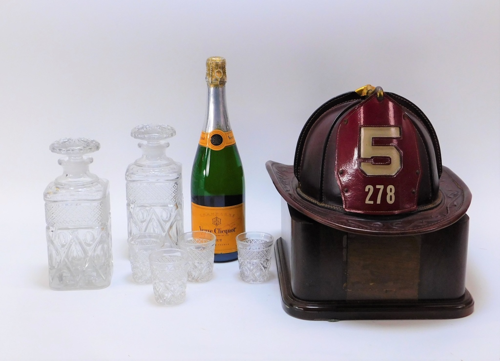 Appraisal: LEATHER FIREMAN HELMET TABLETOP BAR LIQUOR SET United States th