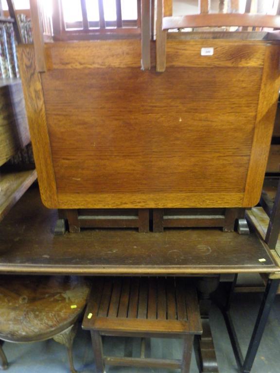 Appraisal: An oak drop leaf table and four chairs a circular