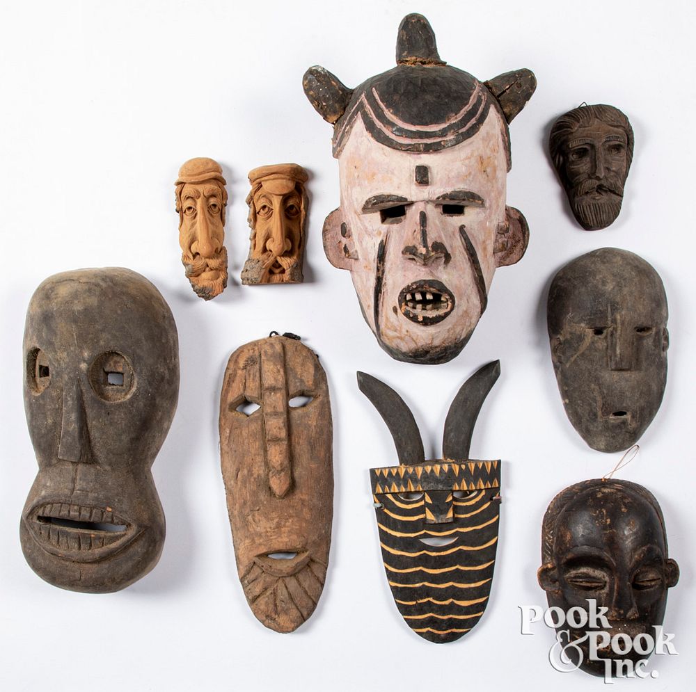 Appraisal: Seven carved tribal masks Seven carved tribal masks largest -