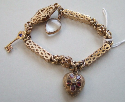 Appraisal: A Victorian gold bracelet on a garnet set clasp fitted