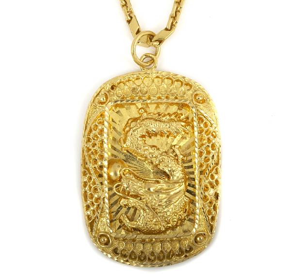 Appraisal: A twenty-four karat gold pendant and chain baht chain with