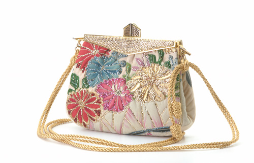 Appraisal: Judith Lieber quilted fabric evening bag handpainted floral motif re-embroidered