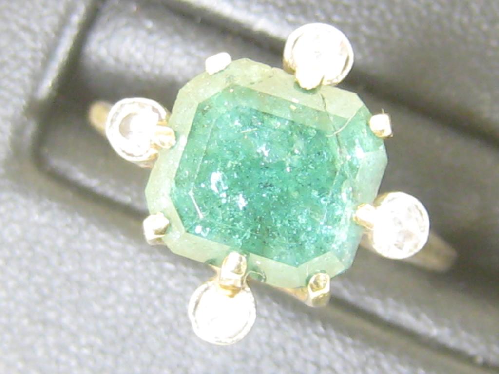 Appraisal: An Emerald and Diamond Ring the large square-cut emerald A