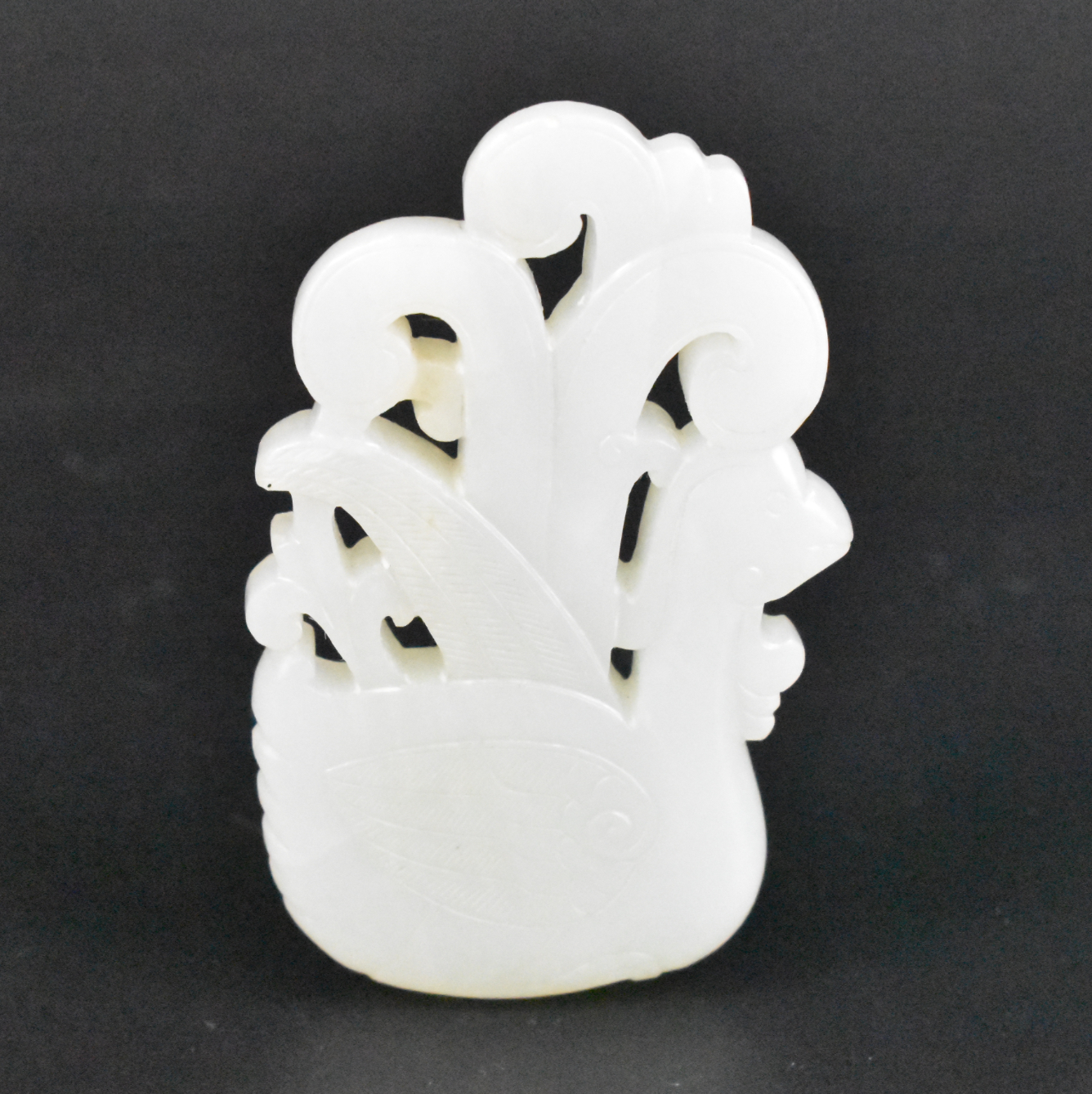 Appraisal: A Chinese white jade carved Phoenix pendant th C A