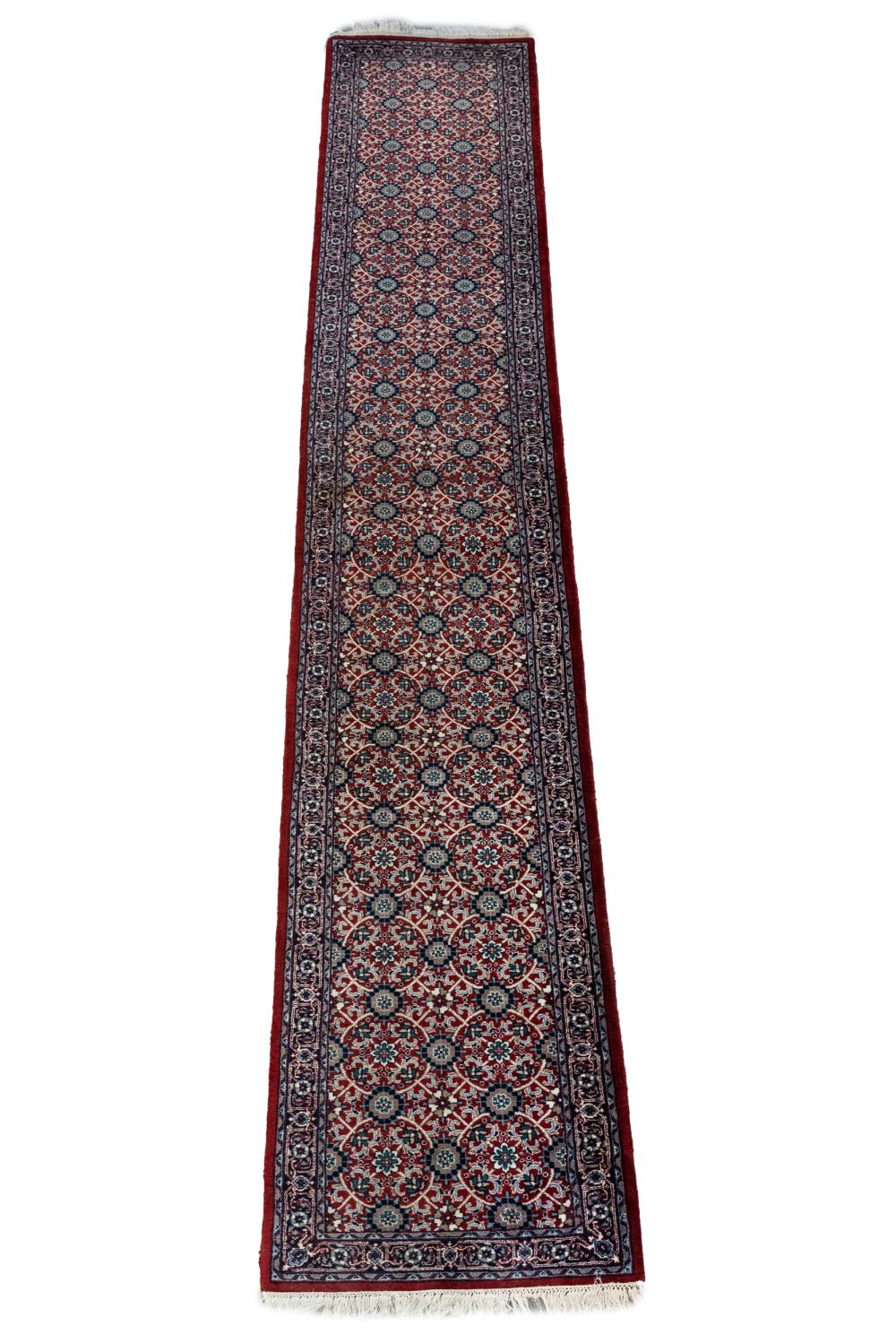 Appraisal: PERSIAN RUNNERwith floral red and blue field ' x '