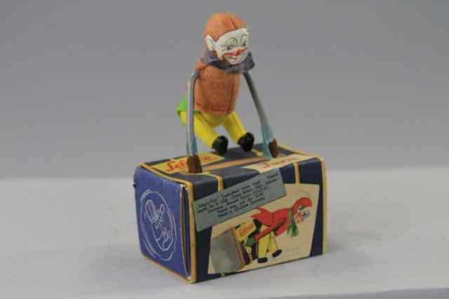 Appraisal: SCHUCO GYMANSTIC CLOWN Germany felt suited clown tin face stands