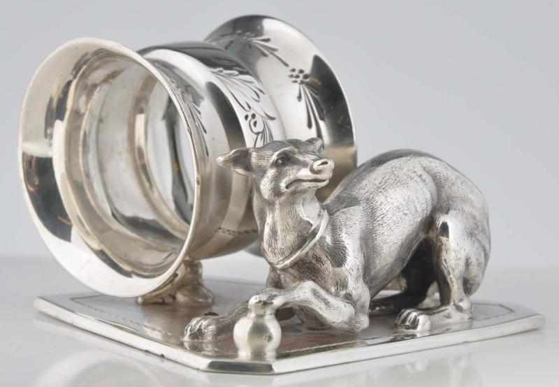 Appraisal: Large Greyhound Figural Napkin Ring Paw on ball on base