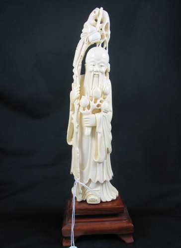 Appraisal: A CARVED CHINESE IVORY FIGURE a Man of Long Life