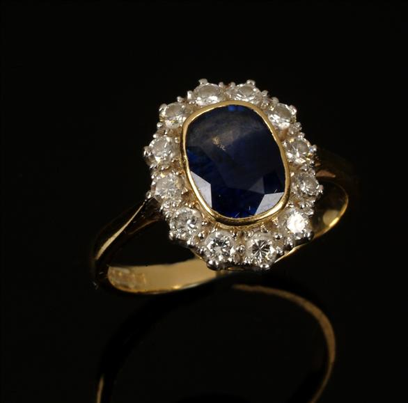 Appraisal: A sapphire and diamond cluster ring the central oblong mixed