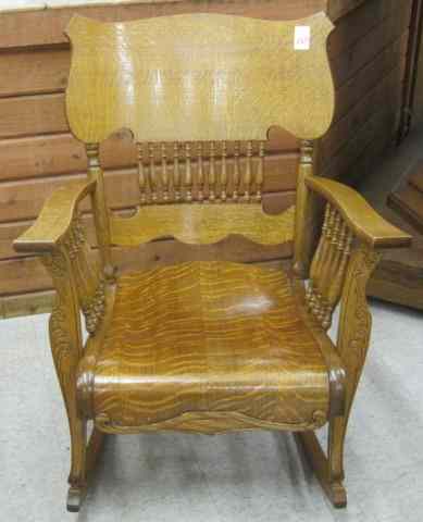 Appraisal: LATE VICTORIAN OAK ROCKING ARMCHAIR American c having a shaped