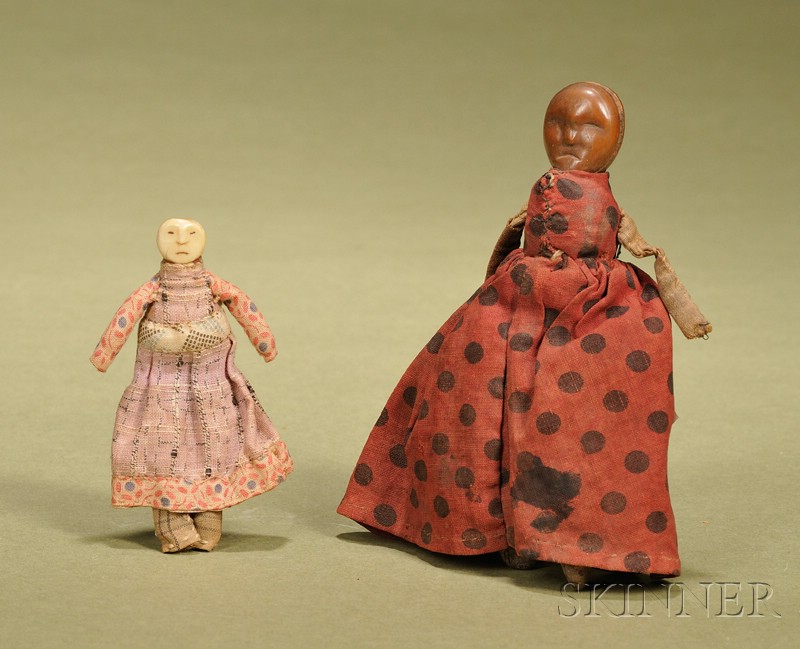 Appraisal: Two Small Folk Art Dolls first with carved wood head