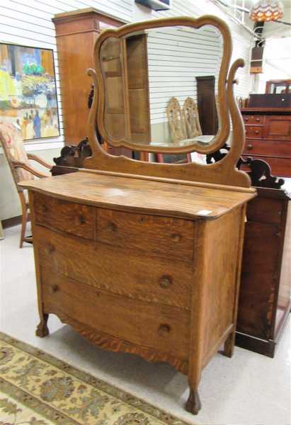 Appraisal: AN OAK DRESSER WITH ATTACHED TILT MIRROR American c the