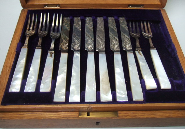 Appraisal: A silver and mother of pearl dessert or fruit set