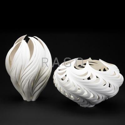 Appraisal: JENNIFER McCURDY Two large carved bisque porcelain vessels Vortex and