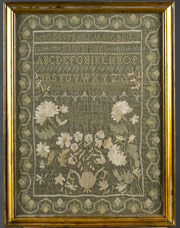 Appraisal: American sampler An American sampler With floral design the alphabet