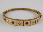 Appraisal: An antique carat gold sapphire and cushion cut diamond bangle