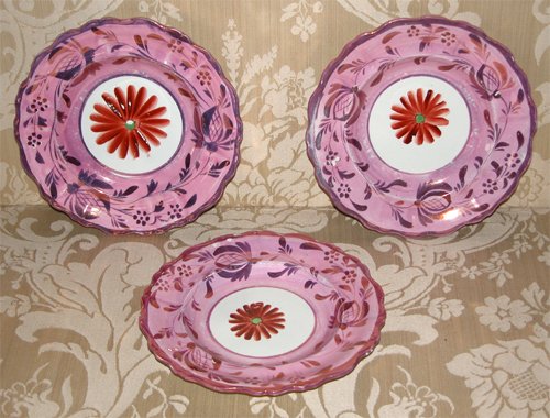 Appraisal: Title Pink Lustreware Scalloped Edge Plates with red daisy painted