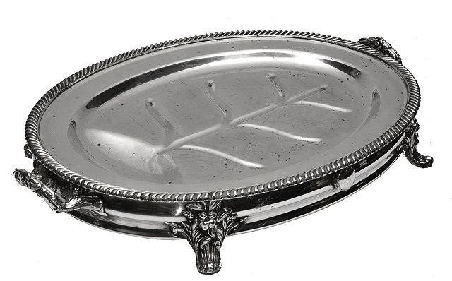 Appraisal: A VICTORIAN SILVER PLATED OVAL WARMING MEAT DISH with gadrooned