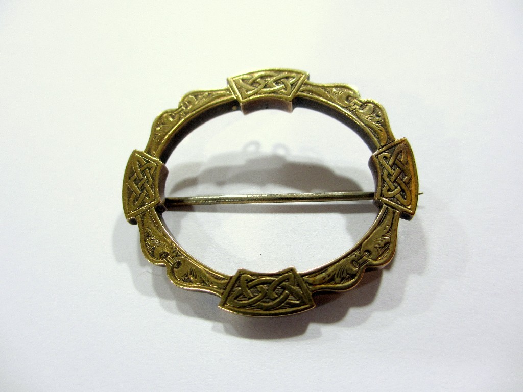 Appraisal: A Victorian gold Celtic style brooch oval annular shape engraved