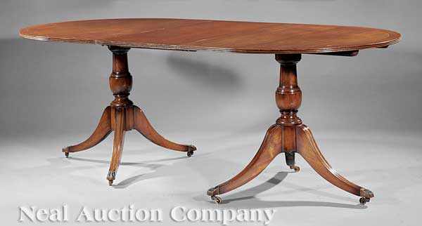 Appraisal: A Regency-Style Mahogany Dining Table c banded D ends one