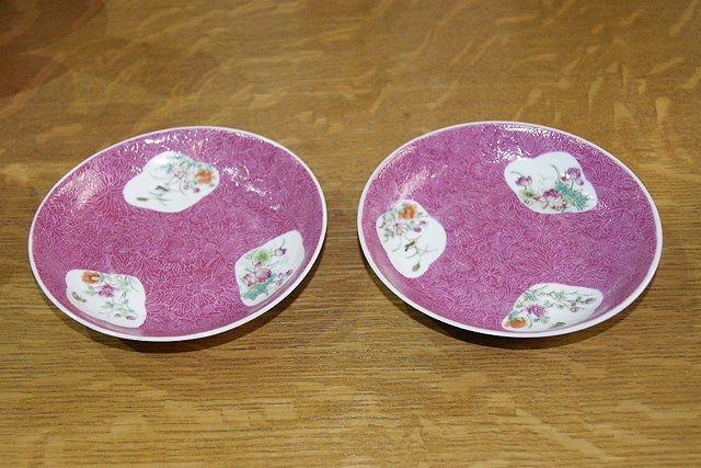 Appraisal: Pair of Chinese famille rose saucersdecorated with three floral reserves