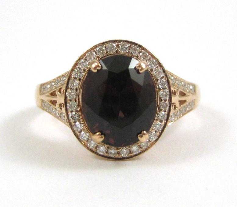 Appraisal: SPINEL AND FOURTEEN KARAT ROSE GOLD RING with round-cut diamonds