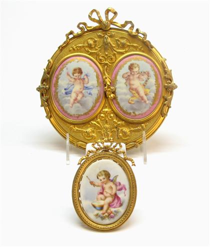 Appraisal: Two piece gilt metal frames with oval porcelain plaques of