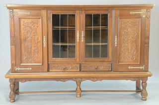 Appraisal: Large oak four door cabinet bookcase having two glass center