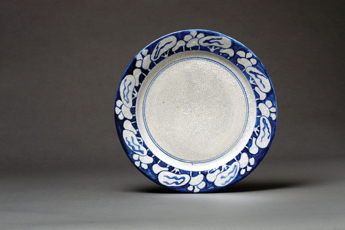 Appraisal: DEDHAM POTTERY 'SNOWTREE' PATTERN PLATE Painted in dark blue with