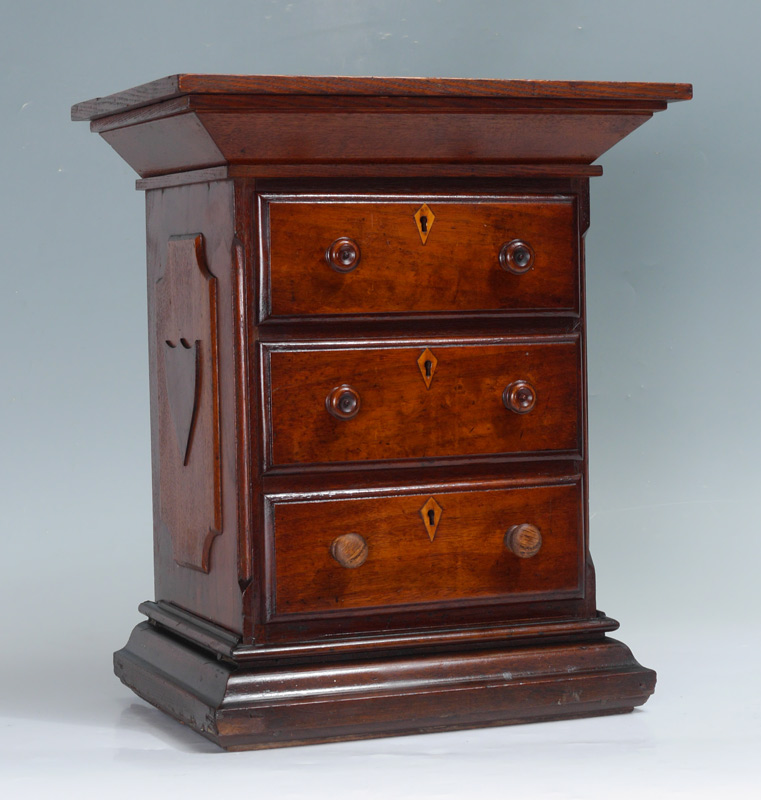 Appraisal: DIMINUTIVE CHEST OF DRAWERS Canted top with hinged lid opens