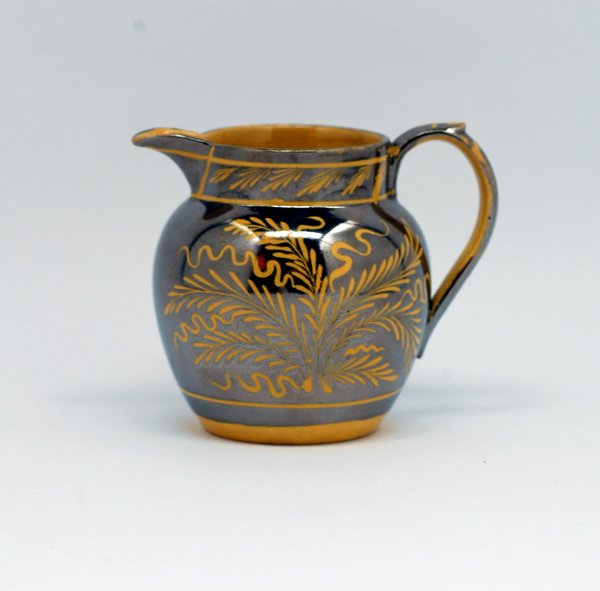 Appraisal: Canary creamer with silver resist decoration MEASUREMENTS - high CONDITION