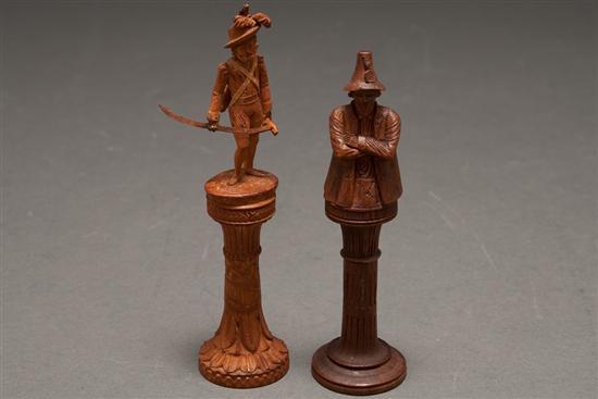 Appraisal: Two Continental carved wood figural needle holders late th century