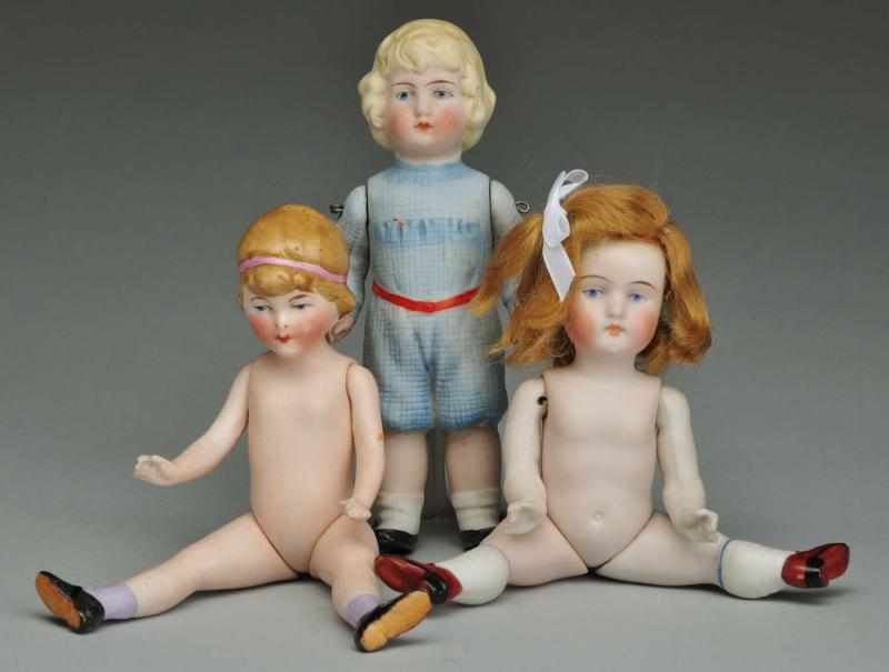 Appraisal: Lot of German All-Bisque Dolls Description Boy with molded blonde