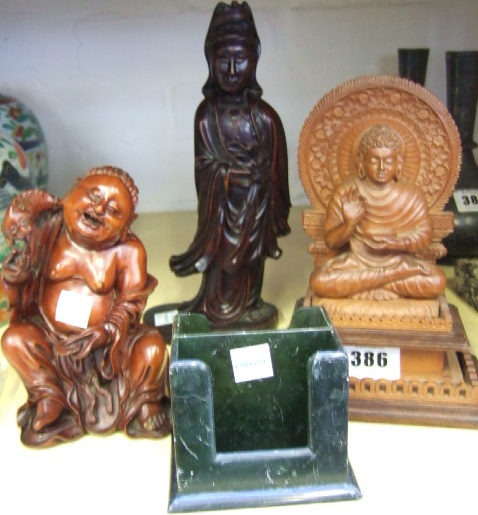 Appraisal: Three South East Asian carved wood figures th century comprising