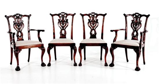 Appraisal: Four Georgian style carved mahogany chairs comprised of arms sides