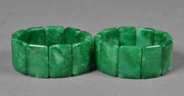 Appraisal: Pair of Spinach Green Jadite Cui BraceletsPair of finely polished