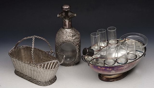 Appraisal: A GLASS AND SILVER PLATED LIQUEUR SET with decanter bowl