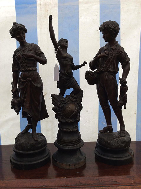 Appraisal: A PAIR OF FRENCH SPELTER FIGURINES of a boy and