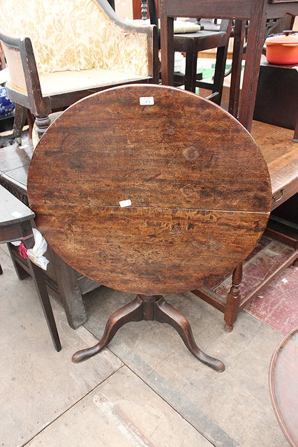 Appraisal: A GEORGIAN OAK CIRCULAR TILT TOP TRIPOD TABLE cm diameter