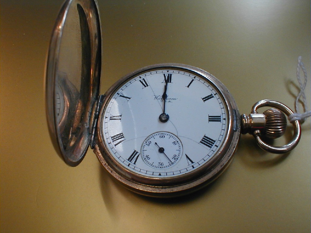 Appraisal: A Waltham full hunter plated pocket watch no glass cracked